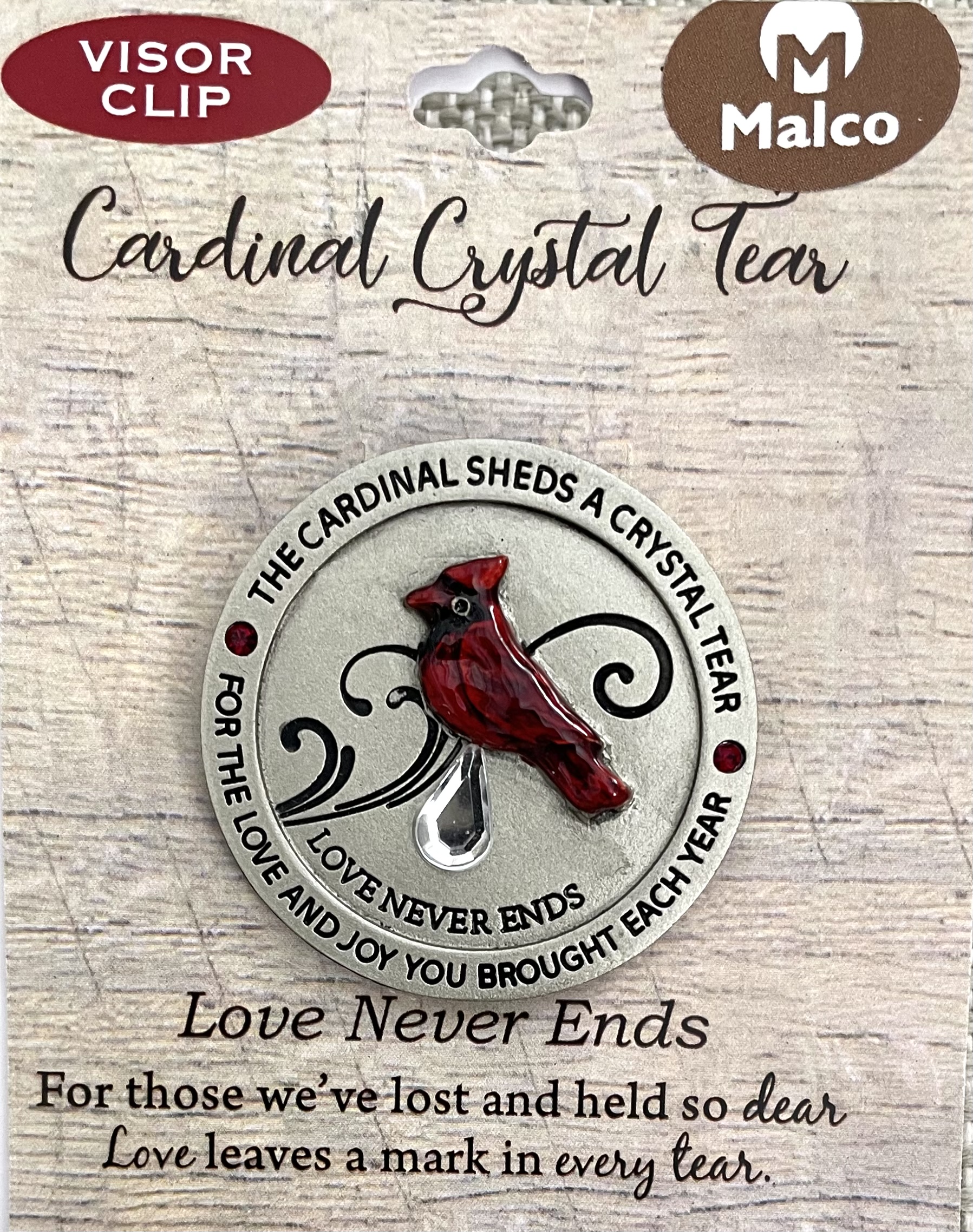 Cardinal Crystal Tear Auto Visor Clip. Cast metal with silver enamel finish and translucent epoxy cardinal and crystal teardrop. Carded.