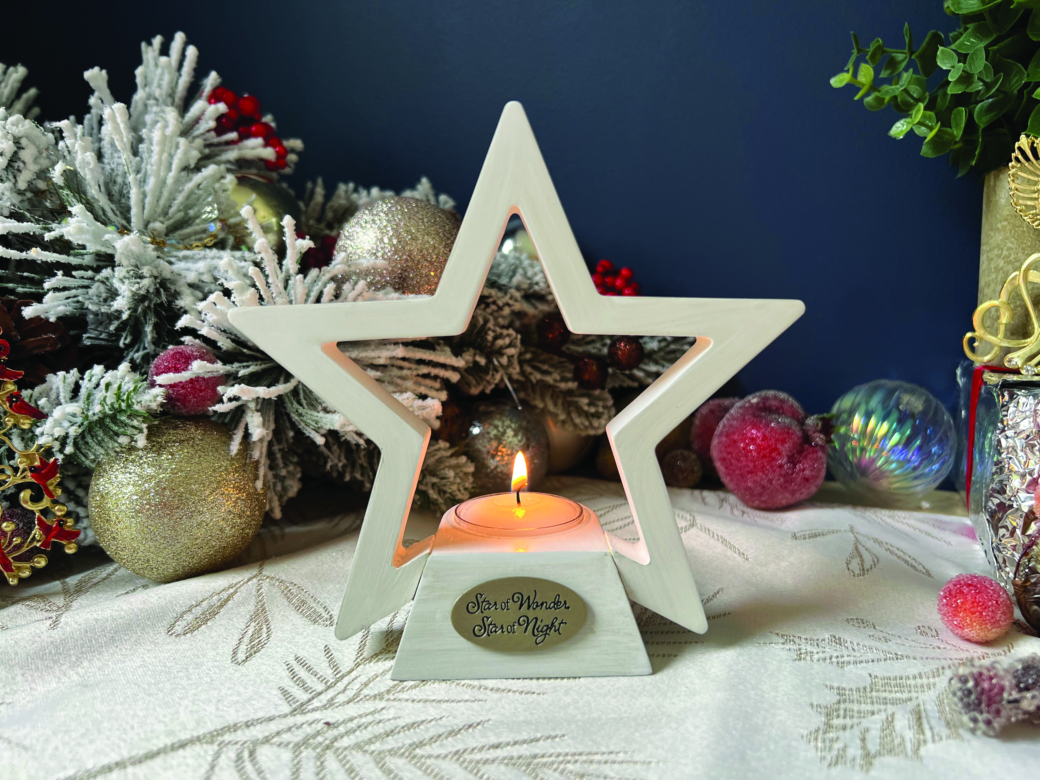 STAR OF WONDER CANDLE HOLDER. HANDCRAFTED WOOD STAR IN WHITEWASH ADORNED WITH CAST METAL PLAQUE IN SILVER ENAMEL. COMPLETE WITH TEA LIGHT 6IN H X 6IN W  