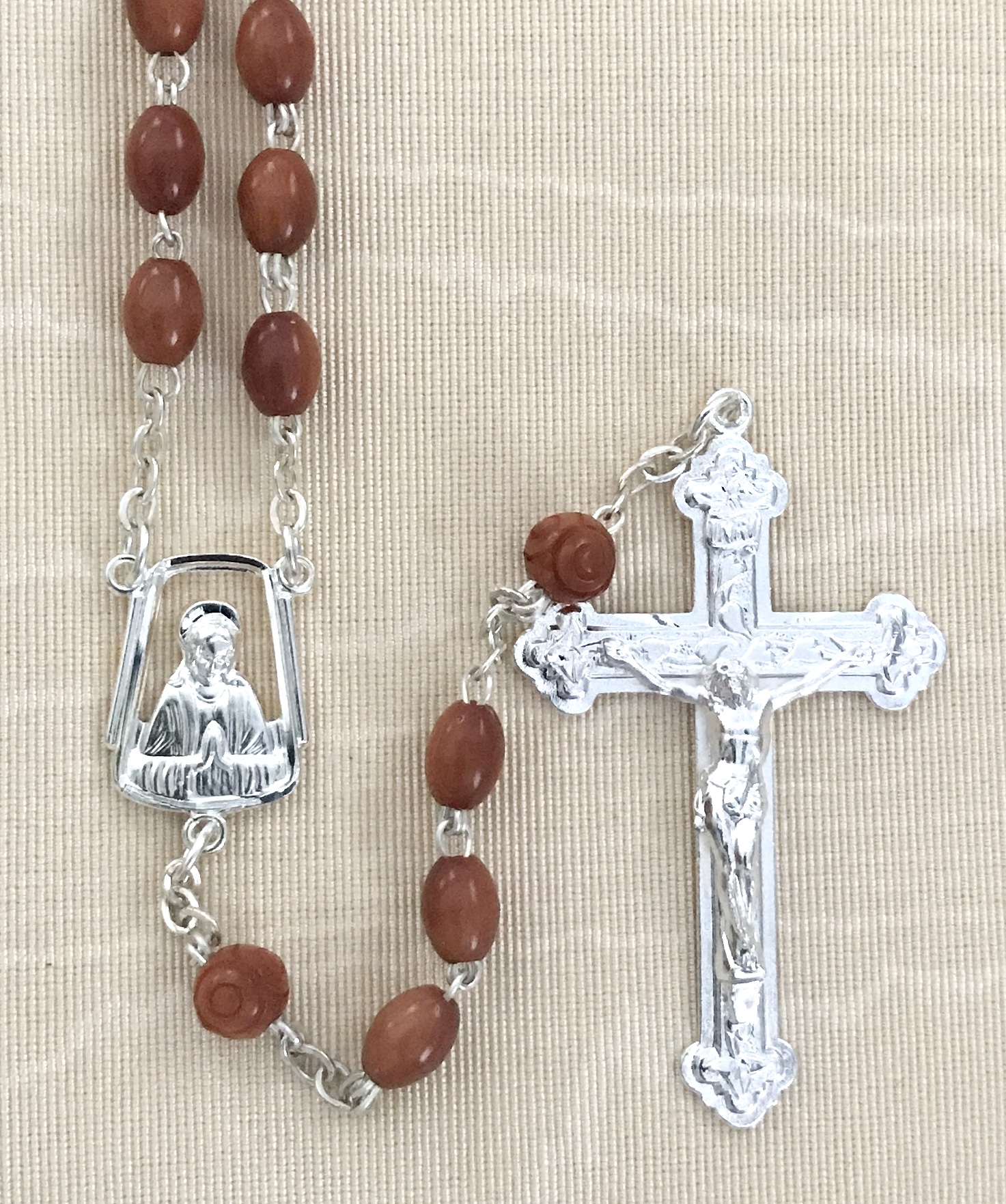 BROWN OVAL COCO ROSARY WITH STERLING SILVER PLATED CRUCIFIX AND CENTER GIFT BOXED