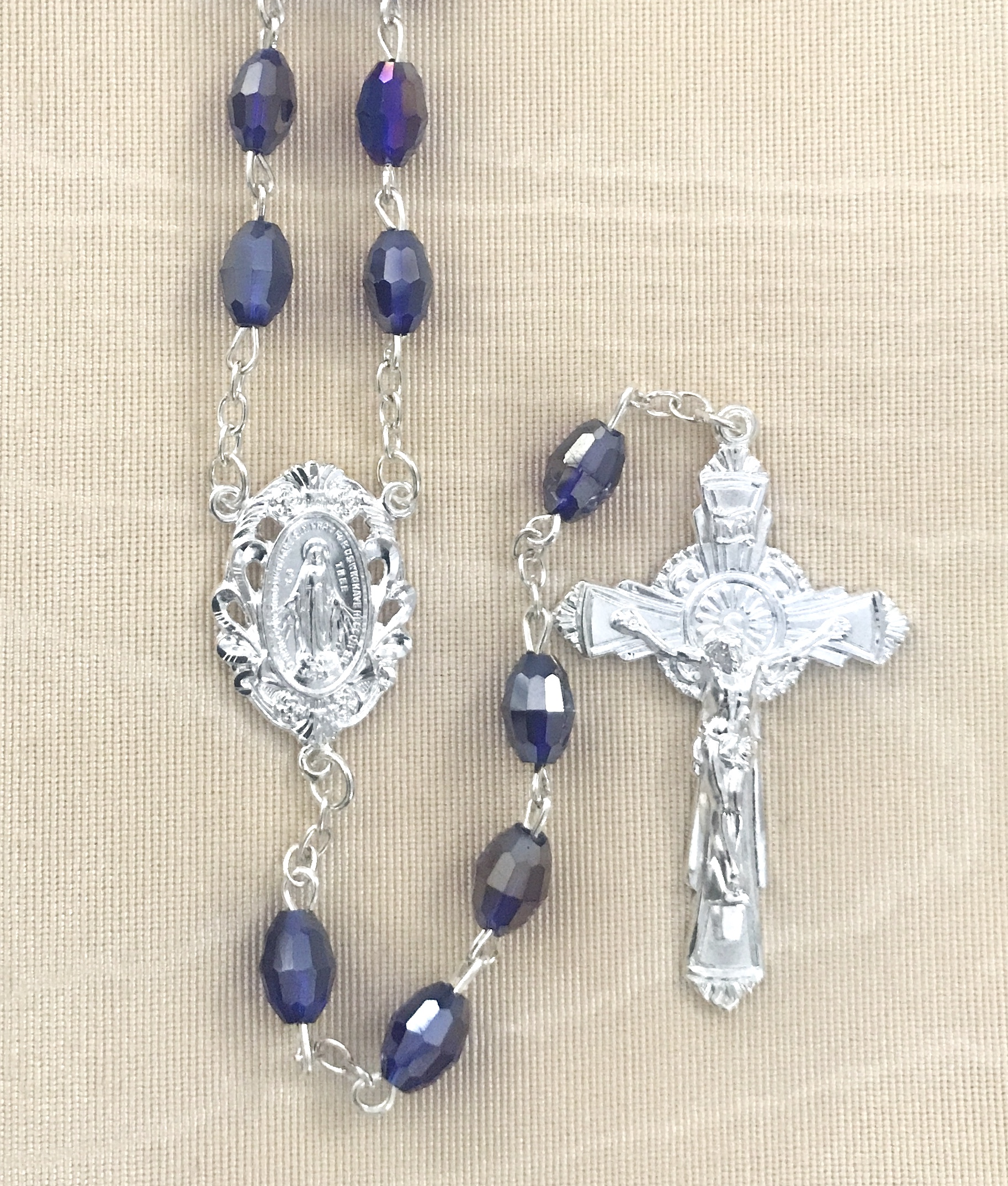 7x5mm TIN CUT SAPPHIRE ROSARY WITH STERLING SILVER PLATED CRUCIFIX AND CENTER GIFT BOXED