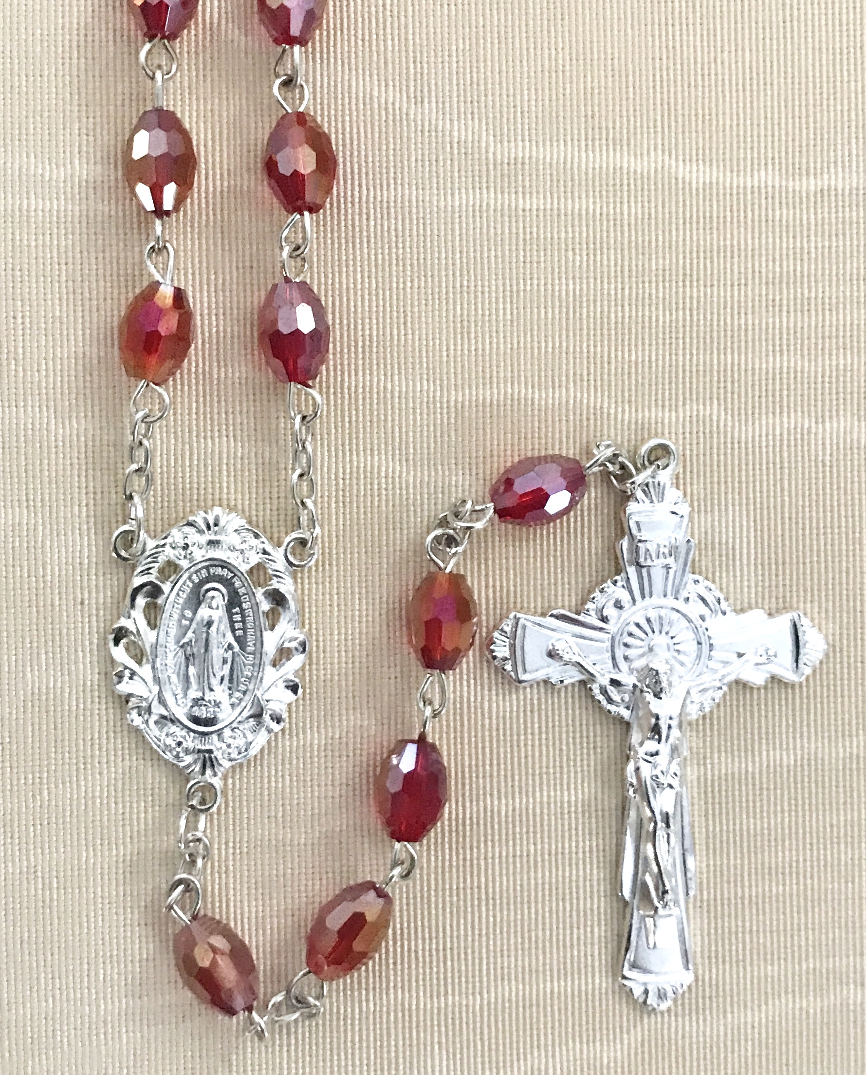 7x5mm TIN CUT RUBY ROSARY WITH STERLING SILVER PLATED CRUCIFIX AND CENTER GIFT BOXED