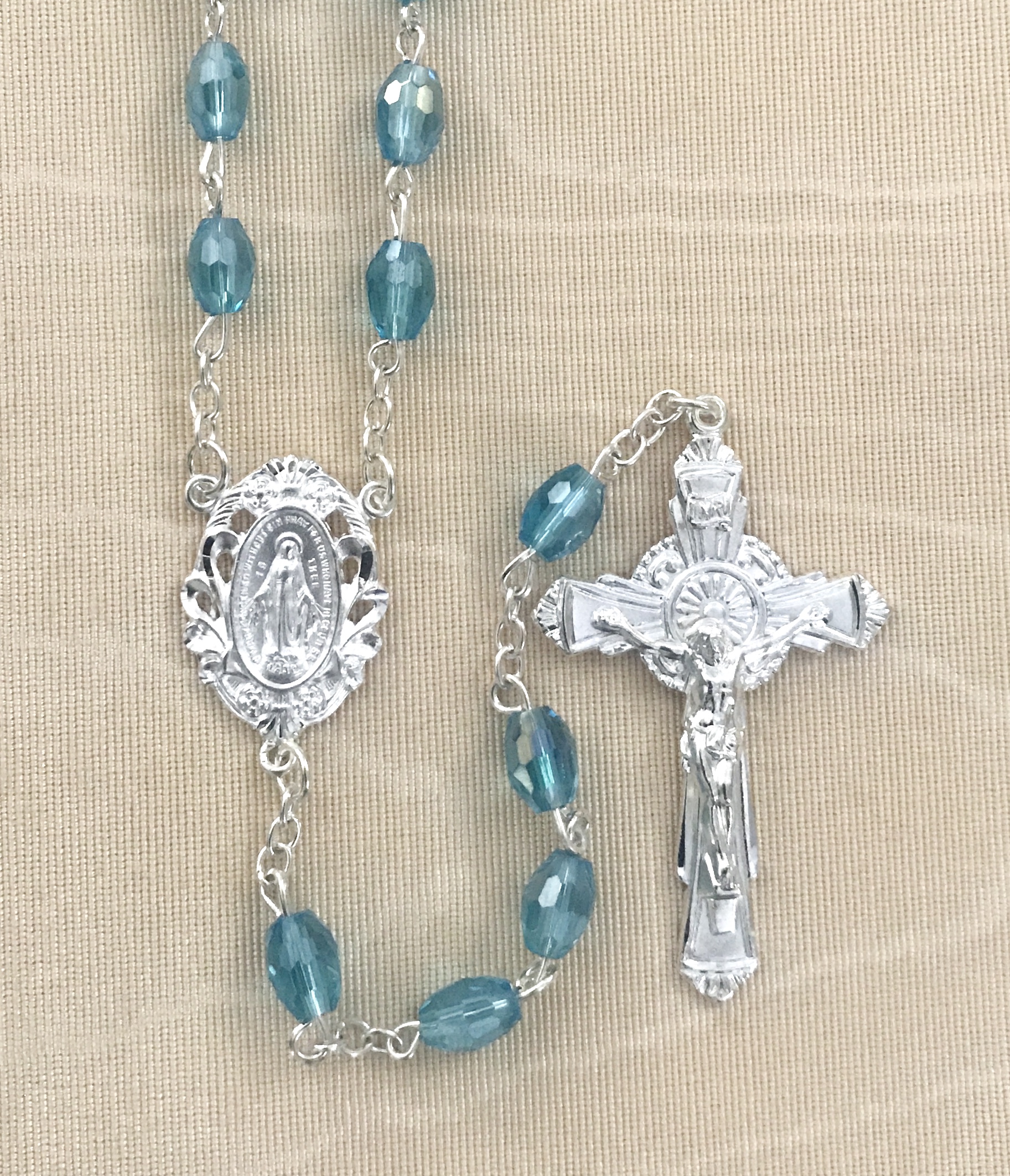 7x5mm TIN CUT AQUA ROSARY WITH STERLING SILVER PLATED CRUCIFIX AND CENTER GIFT BOXED