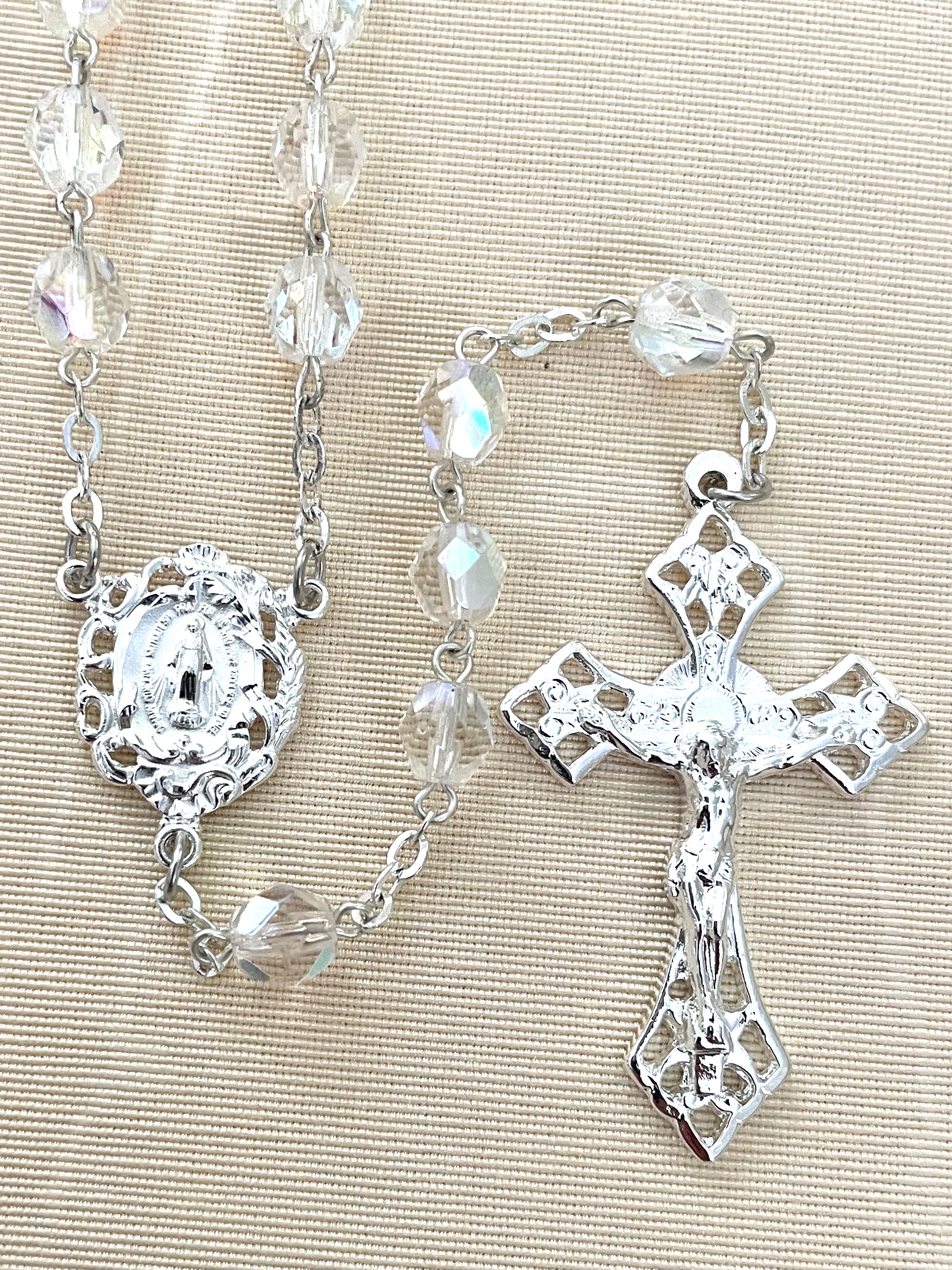 7MM CRYSTAL DIAMOND CUT ROSARY WITH STERLING SILVER PLATE CRUCIFIX AND CENTER. GIFT BOXED