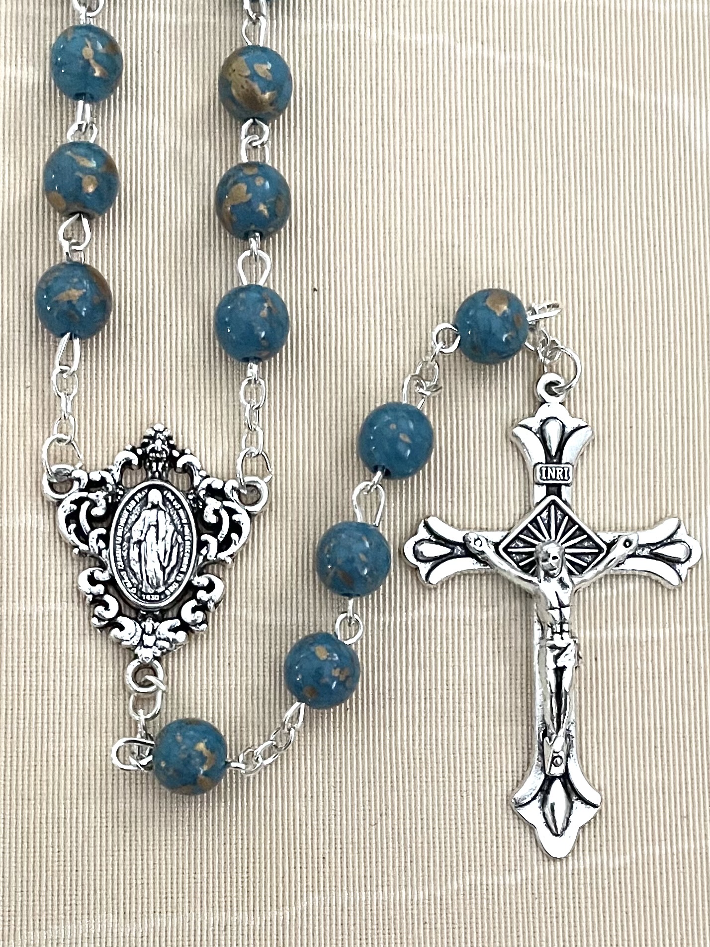 8MM SAPPHIRE SPECKLED ROSARY WITH SILVER OXIDIZED CRUCIFIX AND CENTERPIECE.