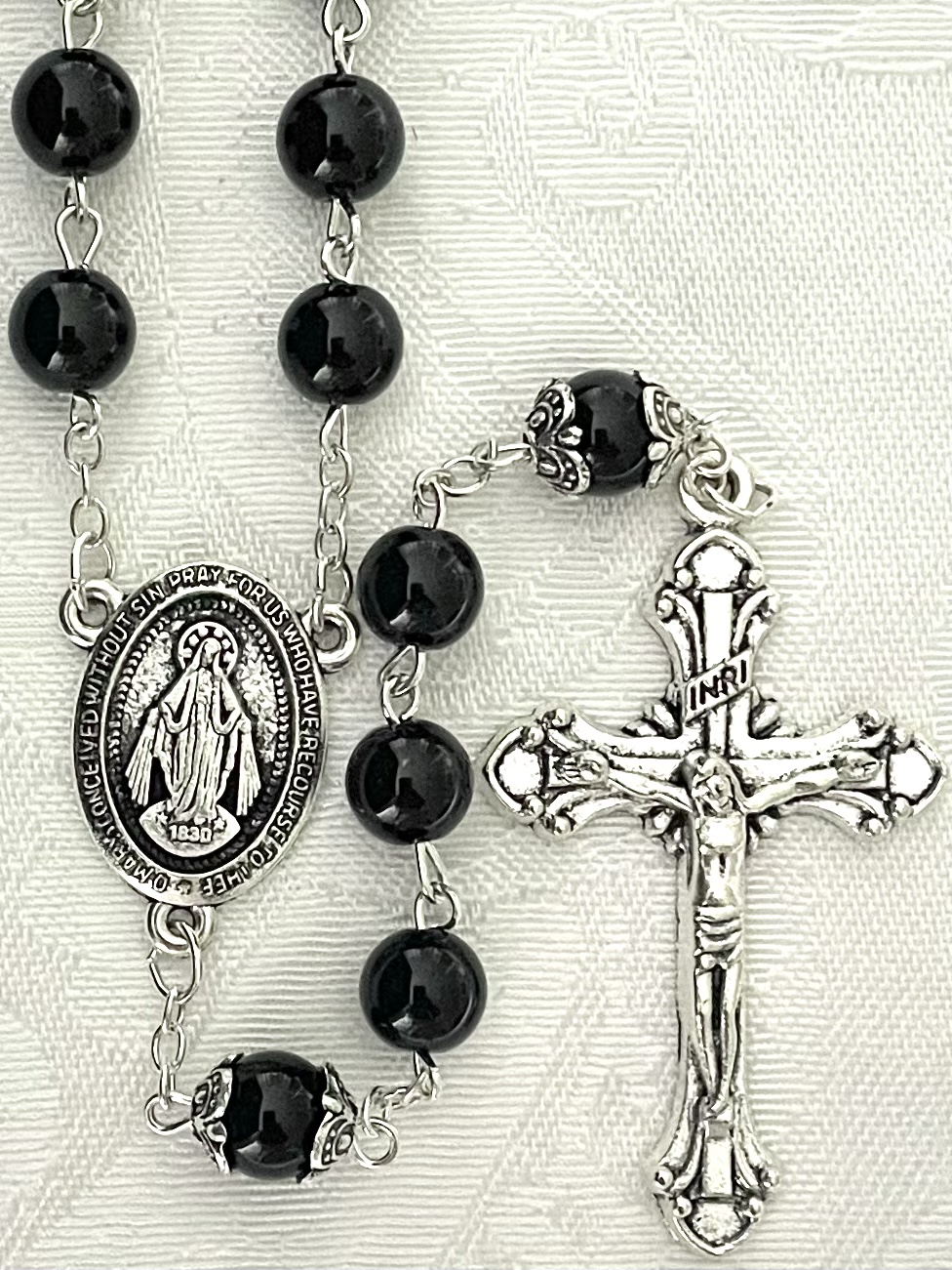 8mm BLACK ONYX ROSARY WITH DOUBLE CAPPED O.F. BEADS. GIFT BOXED