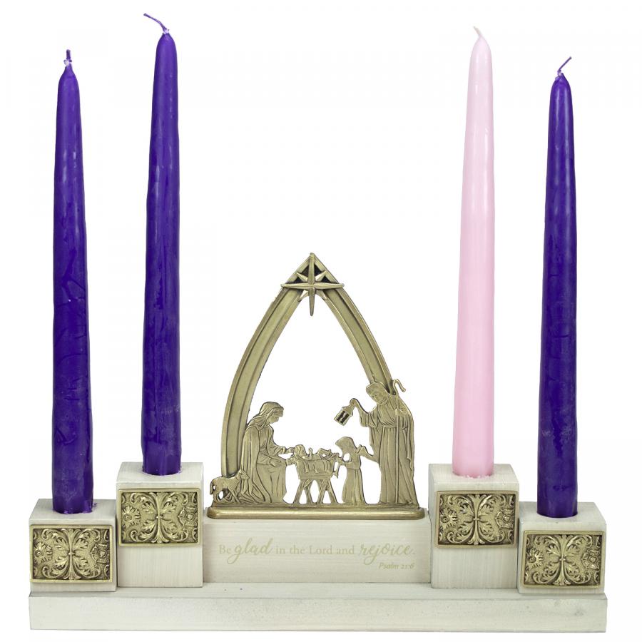 NATIVITY ADVENT CANDLE HOLDER. THE WOOD BASE FEATURES A WHITEWASHED FINISH AND SUPPORTS A FINELY SCULPTED NATIVITY SCENEBOTH THE SCENE AND NATIVITY STAR ARE FINISHED IN BRASS OX. COMPLETE WITH 4 10 IN  ADVENT CANDLES. 11.5 W X 7.5 H X  2.5 D