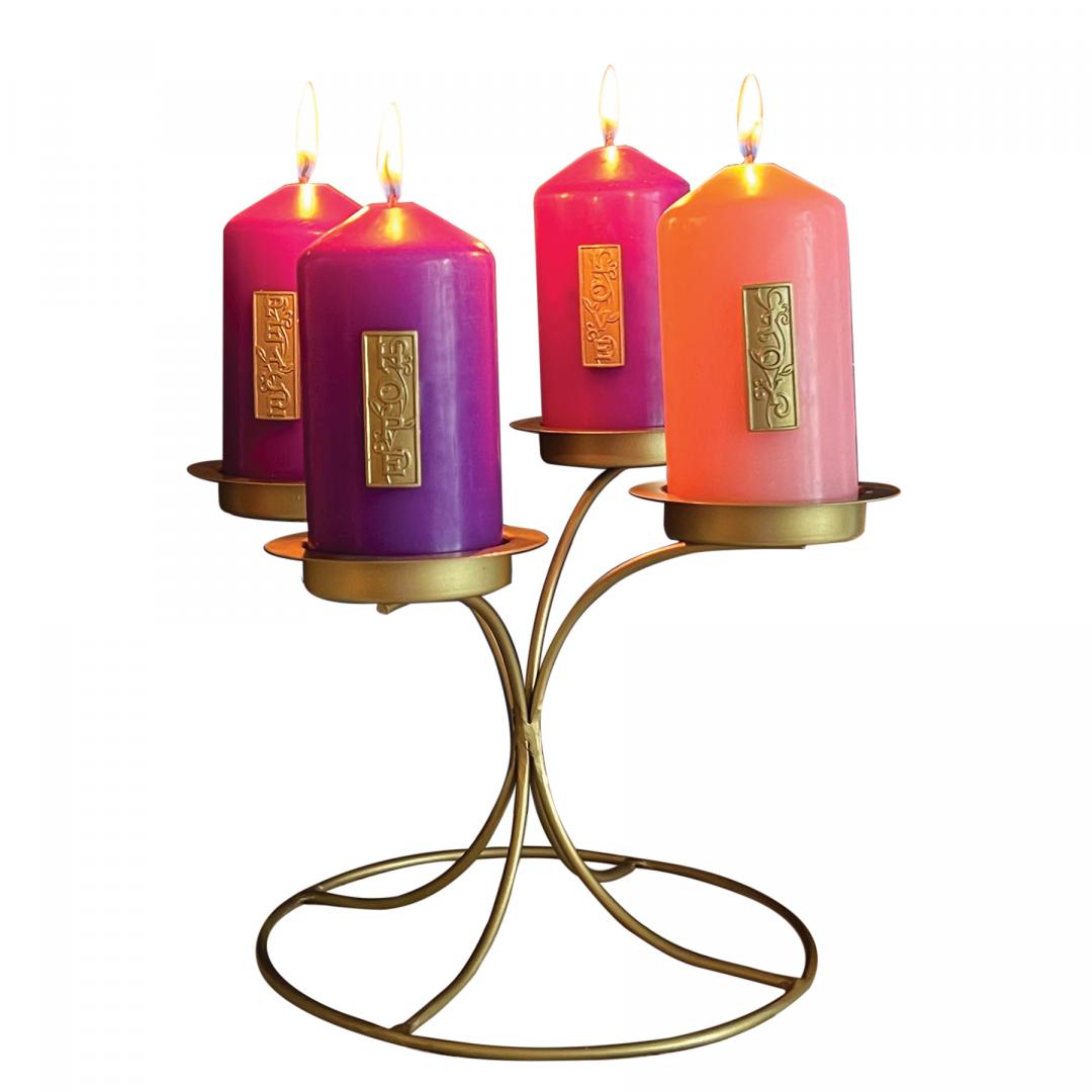 ADVENT CANDLE HOLDER. CONTEMPORARY STYLE FASHIONED FROM METAL WITH METAL CUPS AT VARIOUS HEIGHTS ALL FINISHED IN GOLD ENAMEL. THE SET INCLUDES FOUR VOTIVES EACH ADORNED WITH A GOLD ENAMEL CAST METAL TAG FEATURING THE THEME OF EACH WEEK OF ADVENT. THE ROUND BASE IS 6.75 IN DIAMETER WITH HEIGHT OF 6 IN AND WIDTH OF 8.5 IN. VOTIVES ARE 4 IN X 2 IN. BOXED