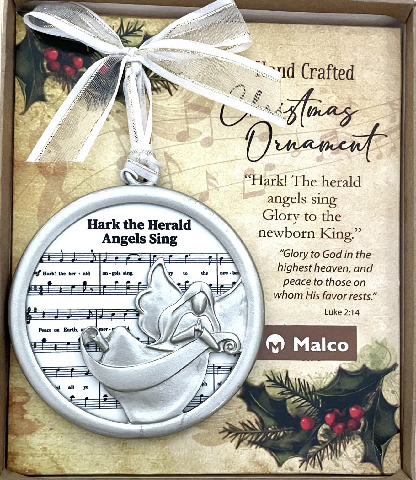 HARK THE HERALD ANGELS SING CHRISTMAS CAROL ORNAMENT. CAST METAL, FINISHED IN SILVER ENAMEL, FRAME SUBLIMATED WOOD WHICH FEATURES SHEET MUSIC. HANGS FROM WHITE ORGANZA RIBBON. ORNAMENT SITS ON A DECORATIVE PAD, HIGHLIGHTING A SEFMENT OF THE CAROL WITH CORRESPONDING SCRIPTURE. 3.5 IN DIAMETER. WINDOW BOXED