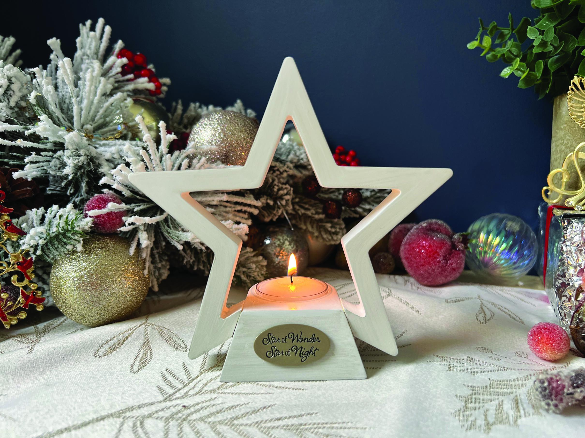 STAR OF WONDER CANDLE HOLDER. HANDCRAFTED WOOD STAR IN WHITEWASH ADORNED WITH CAST METAL PLAQUE IN SILVER ENAMEL. COMPLETE WITH TEA LIGHT 6IN H X 6IN W  