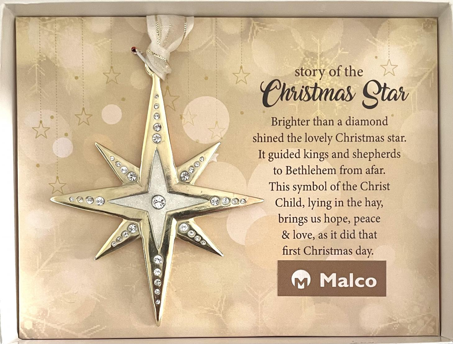 CHRISTMAS STAR ORNAMENT. CAST METAL WITH GOLD PLATED FINISH AND WHITE GLITTER ENAMEL AND SPARKLING INSET GEMSTONES. HANGS ON WHITE ORGANZA RIBBON 3IN W X 3.5IN H. WINDOW BOXED