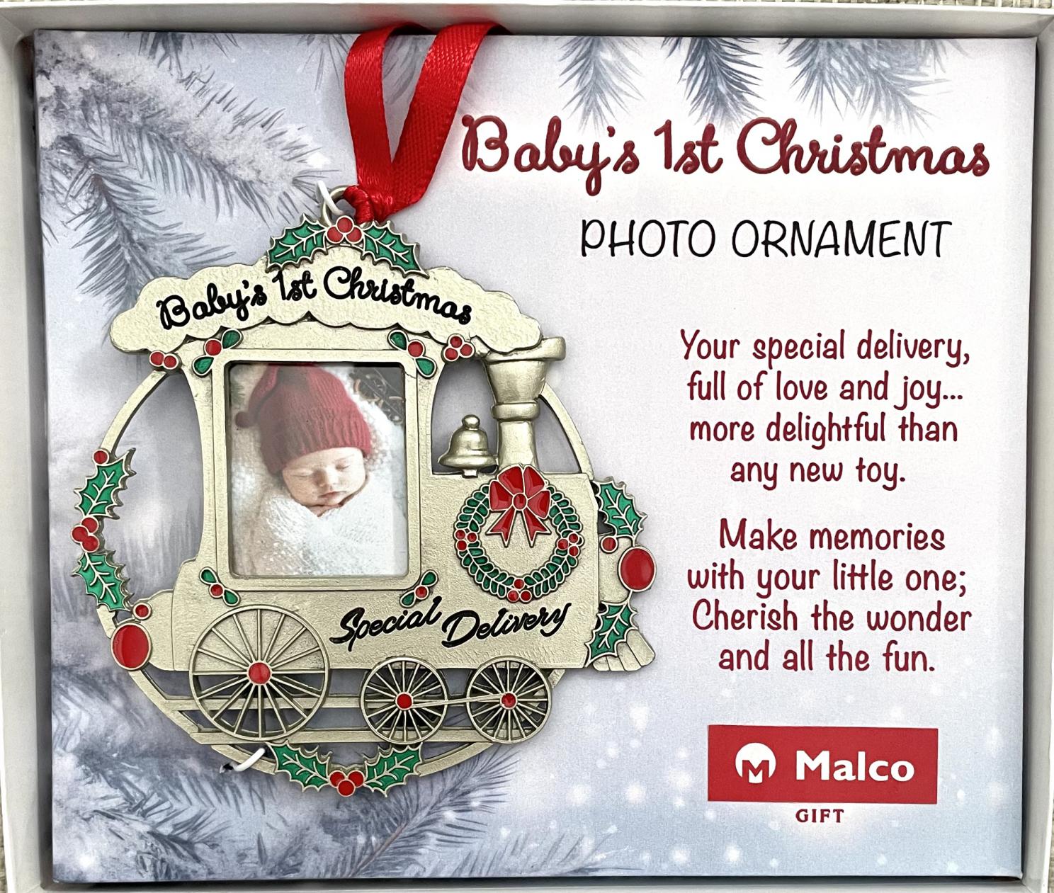 BABY'S FIRST CHRISTMAS PHOTO ORNAMENT. Sculpted cast metal, finished in silver enamel, with sparkling crystal stones and epoxy. Size: 4in x 4in. Gift Boxed. BABY'S FIRST CHRISTMAS PHOTO ORNAMENT. Sculpted cast metal, finished in silver enamel, with sparkling crystal stones and epoxy. Size: 4in x 4in. Gift Boxed.