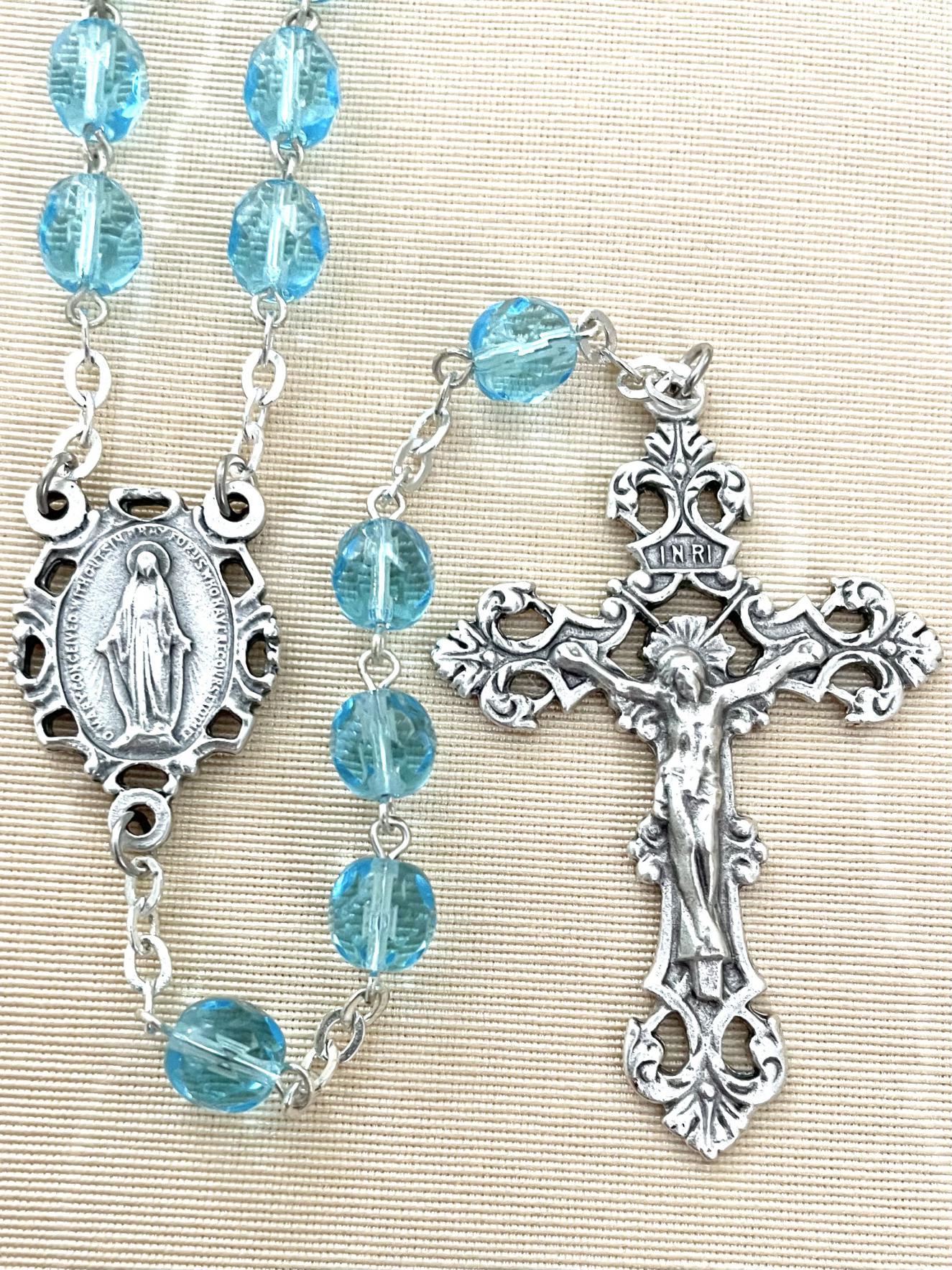 7MM AQUA DIAMOND CUT ROSARY WITH ROMAGNA CRUCIFIX AND CENTER. GIFT BOXED
