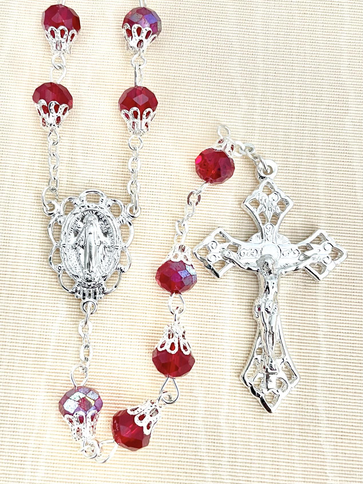 8X6 TIN CUT CAPPED AB RUBY ROSARY WITH STERLING SILVER PLATED CRUCIFIX AND CENTER, GIFT BOXED