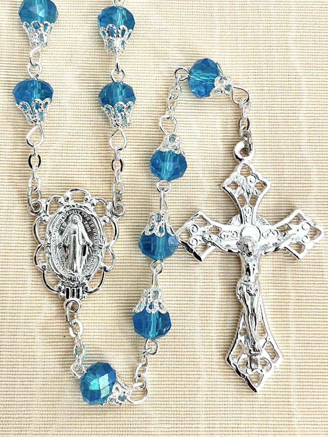 8X6 TIN CUT CAPPED AB AQUA ROSARY WITH STERLING SILVER PLATED CRUCIFIX AND CENTER, GIFT BOXED