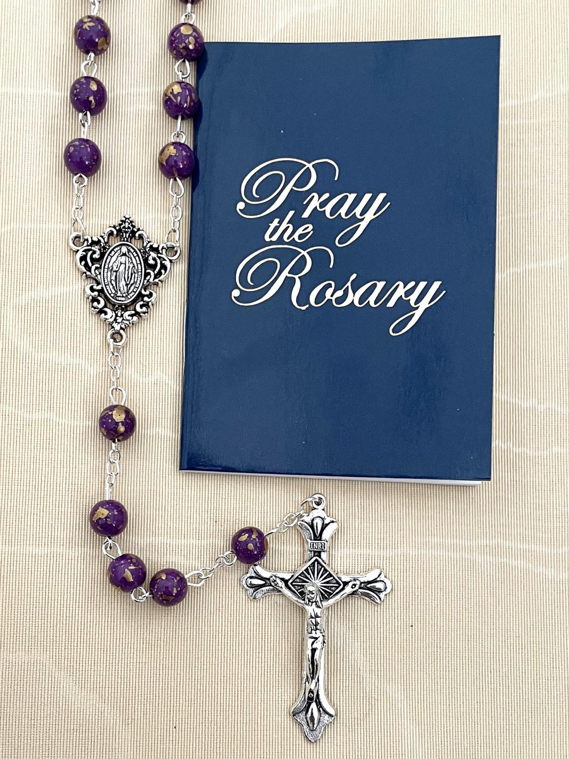 8MM AMETHYST GOLD SPECKLED ROSARY WITH HOW TO SAY THE ROSARY BOOKLET. PACKAGED IN HANGING BAG FOR DISPLAY PURPOSES